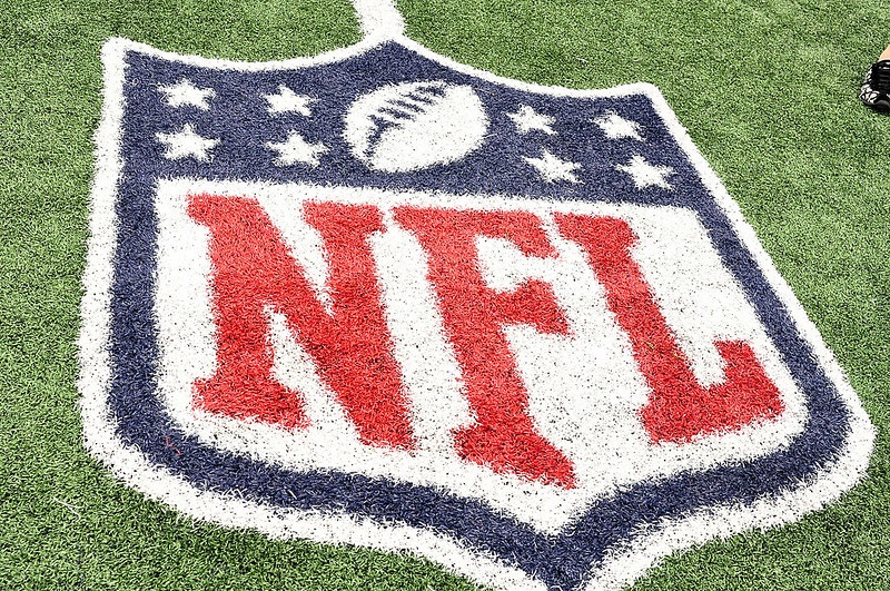 Photo of the NFL logo painted on a football field.