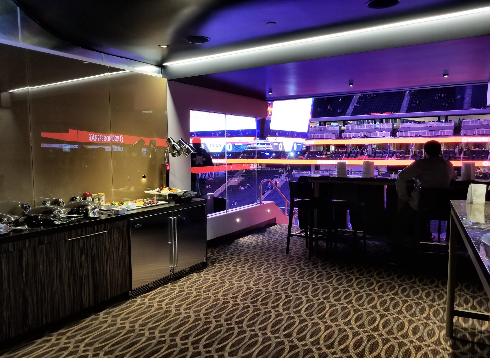 Interior photo of a suite at Rogers Place during an Edmonton Oilers game.