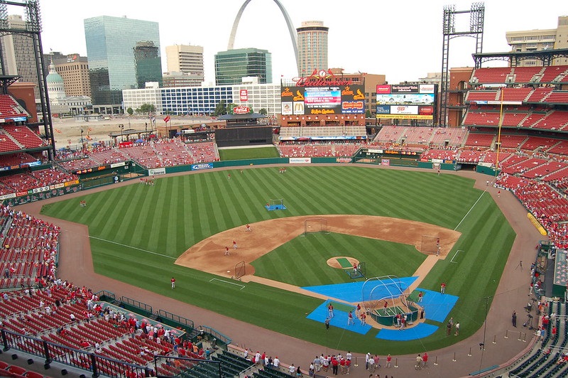 The arches high above Busch Stadium cast a long shadow over the playing  surface as the afternoon sun begins to fall during the Cincinnati Reds and  the St. Louis Cardinals game in